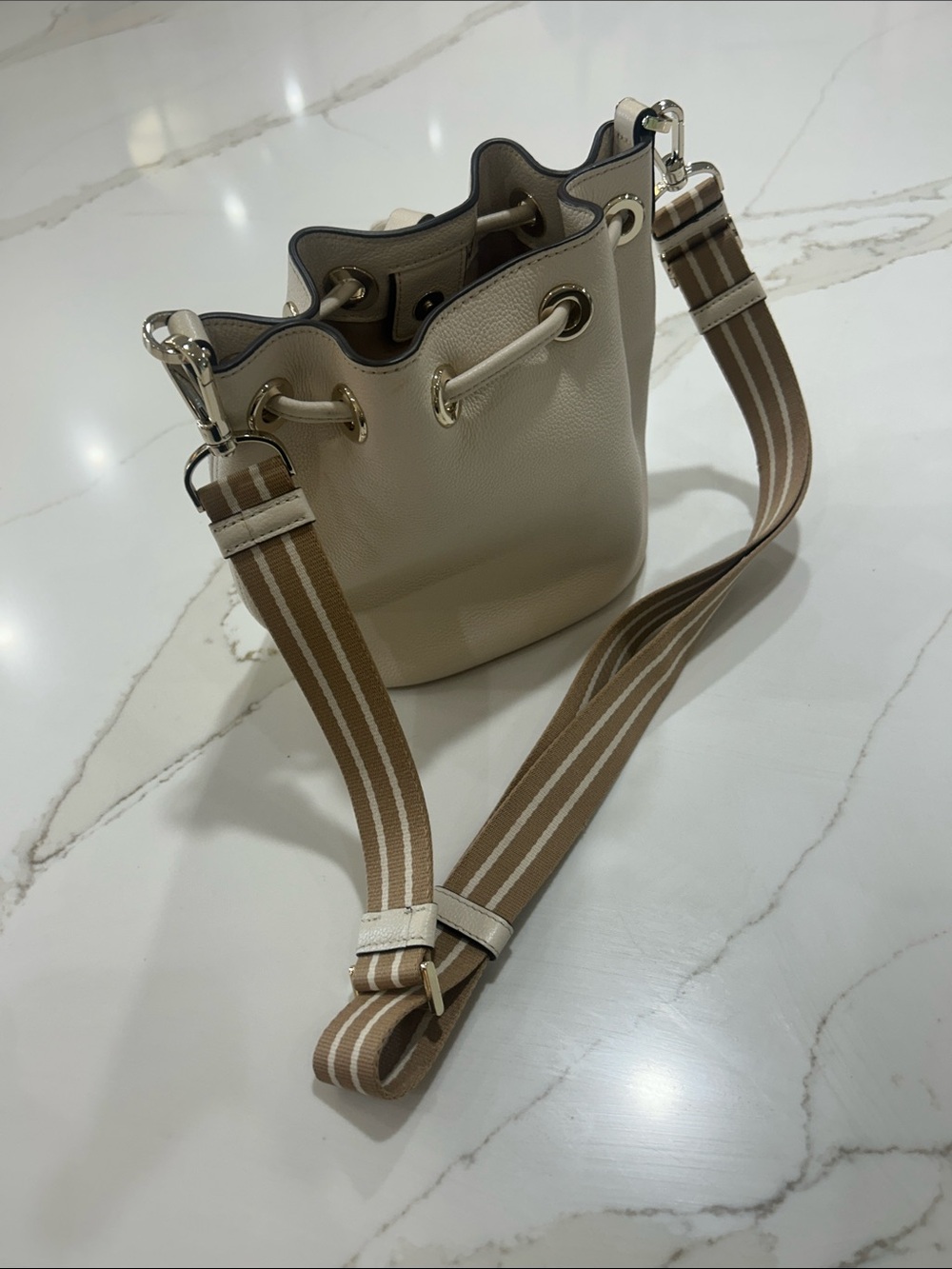 kate spade Cream Pebbled Leather Drawstring Crossbody with Striped Strap - Picture 2 of 7